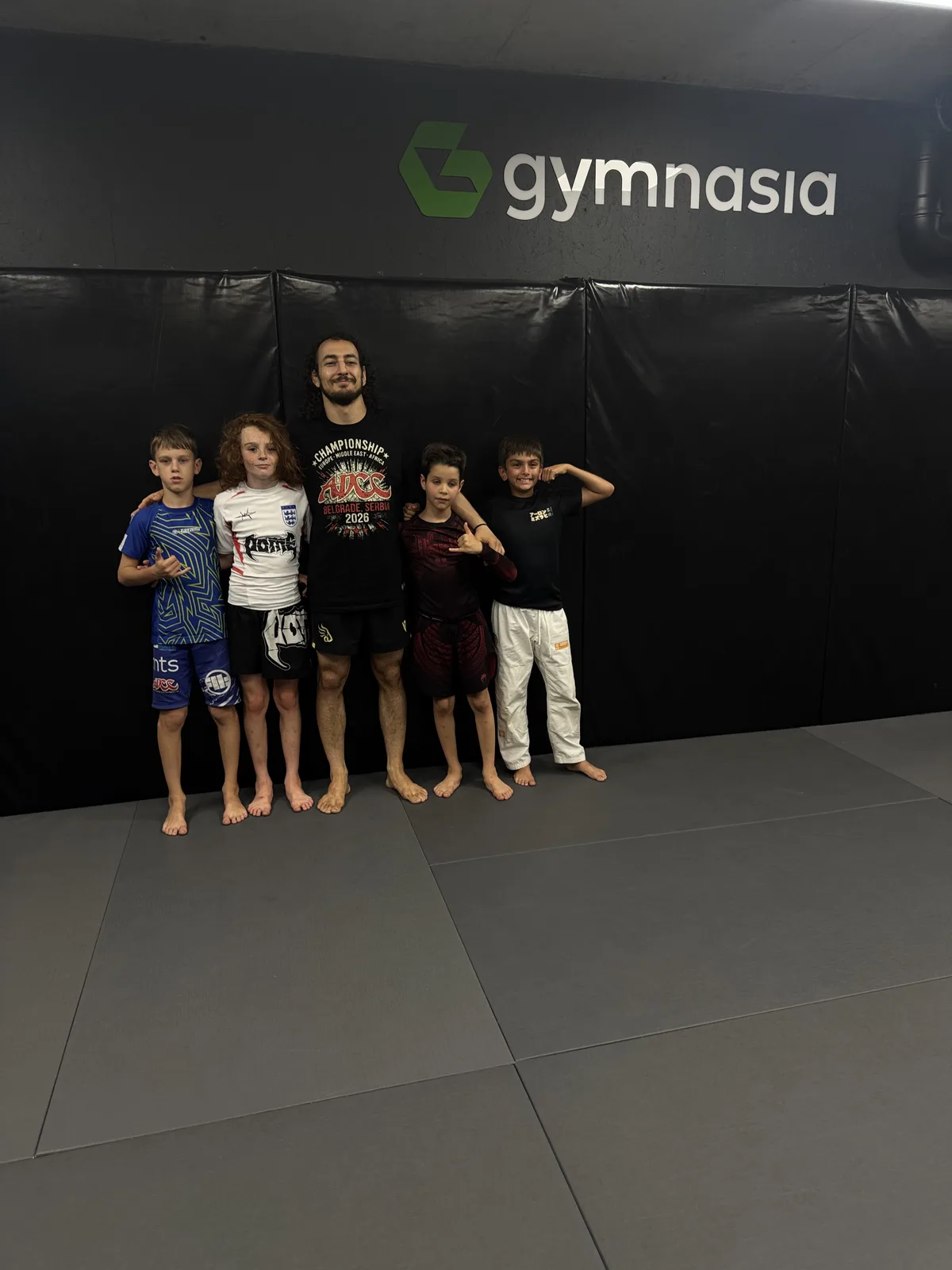 Archive photo of a junior training group with their coach at the Tbilisi facility